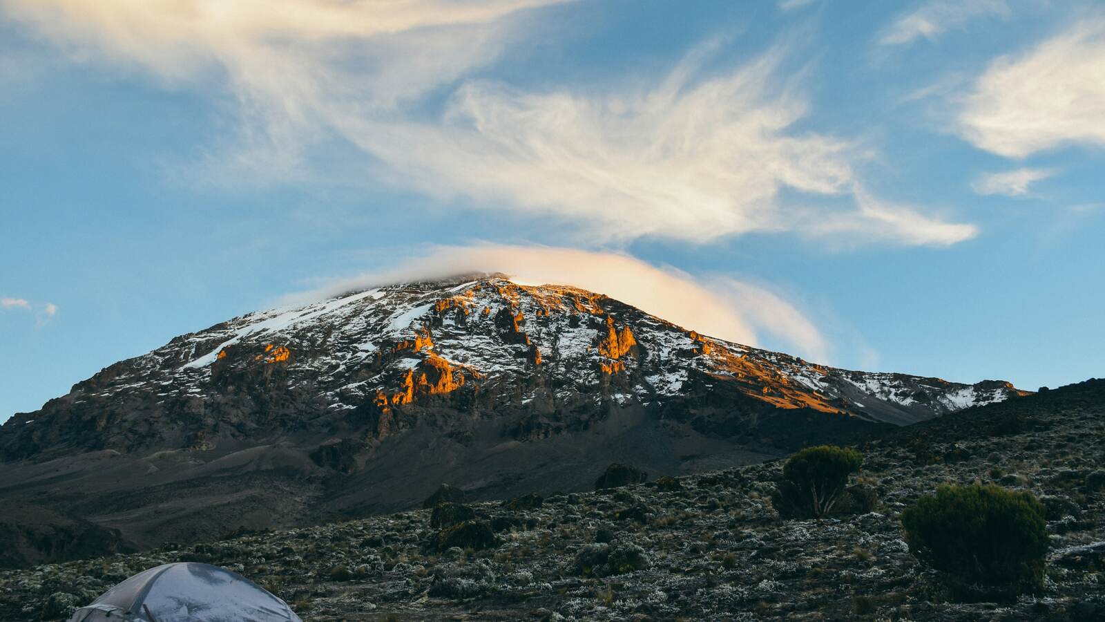 Tents at a Kilimanjaro campsite at sunrise